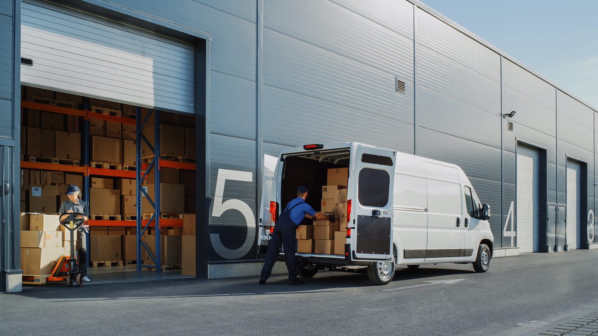 Outside of a bonded Warehouse, LCL Carrier Worker Loading Delivery Truck with Boxes. Cargo Van, Import Clearance, delivery, freight management.